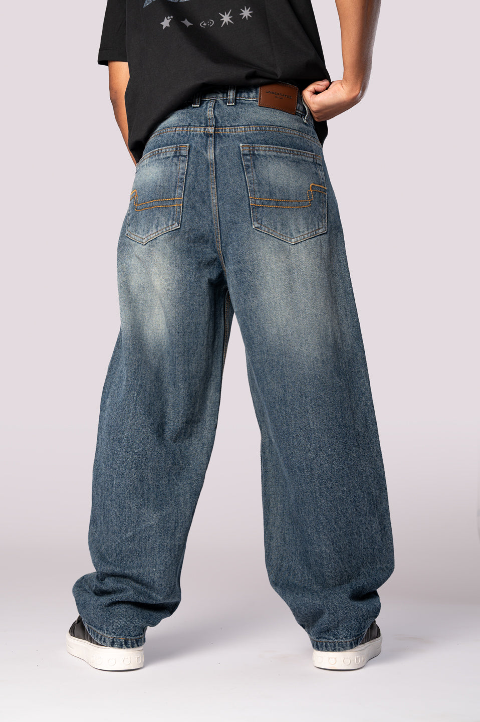 Full-length front view of the dark wash baggy relaxed fit denim jeans.