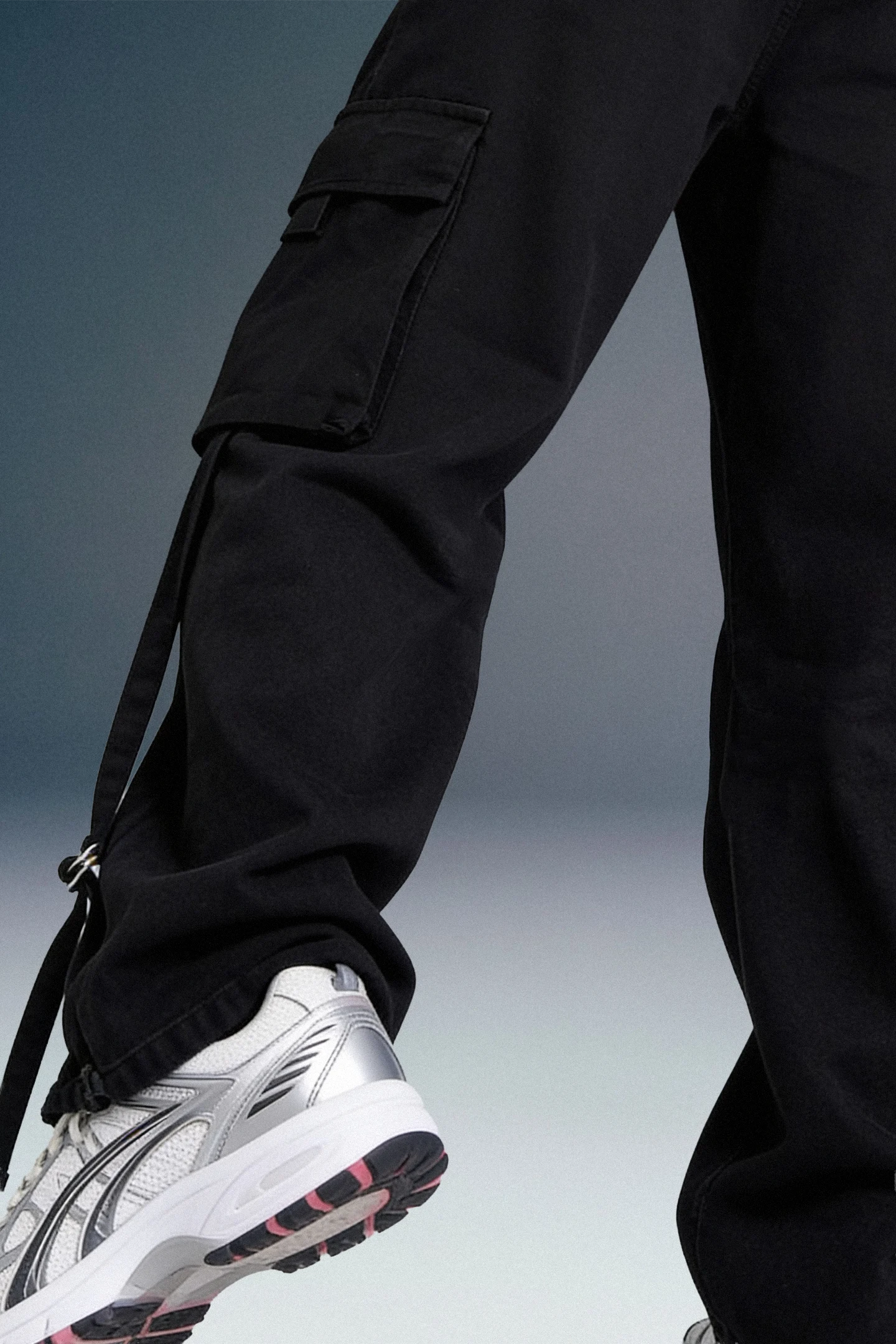 Close-Up of Black Cargo Pants Hem and Sneaker Styling