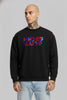 Close-up of a man in a black sweatshirt featuring a stylized 