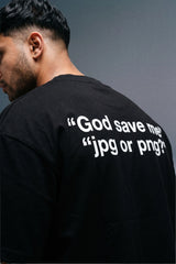 A man shown from the back wearing a black t-shirt with white text on the back that reads “God save me 
