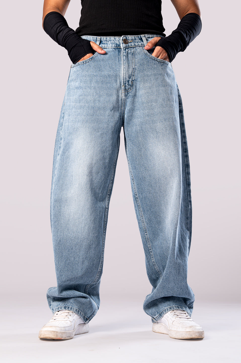 Front view of the light wash baggy jeans, focusing on the mid-rise waist.