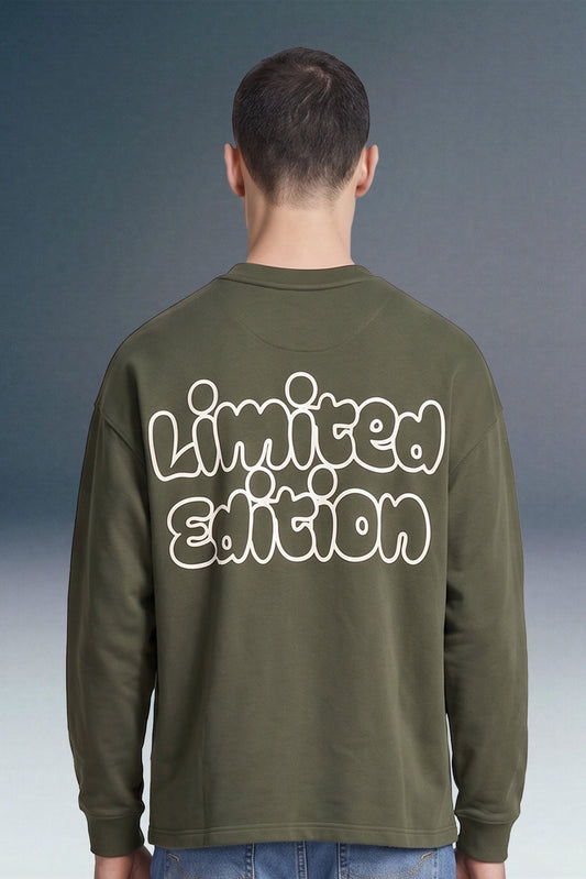 A man viewed from behind wearing an olive green long-sleeve sweatshirt with 'Limited Edition' printed in large white bubble letters across the back, set against a dark gray gradient background.