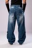 Full-body back view of a person wearing light-wash blue baggy cargo jeans, showing the back pockets and faded details.