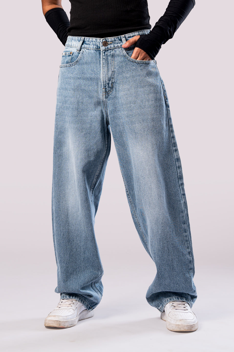 Full-length front view of the light wash baggy jeans, highlighting the wide fit.