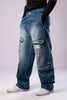Angled side view of a person wearing light-wash blue baggy cargo jeans, showing the multiple pockets and loose fit.
