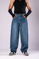Front view of the jeans on a model, highlighting the wide leg opening.