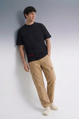 Men's Black Oversized T-Shirt Full Length — Paired with Khaki Pants | Streetwear Outfit
