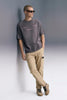 Men's Dark Grey Oversized T-Shirt Full Length — Styled with Beige Pants | Underrated Club
