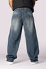 Full-length back view of the dark wash baggy relaxed fit denim jeans.