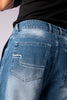 Close-up of the back pocket of light-wash blue jeans, showing white decorative stitching.