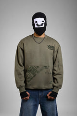 Person wearing an olive green 