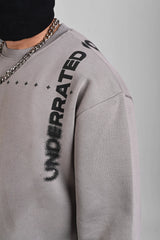 Side view of a grey sweatshirt with black vertical 