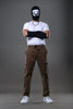 Light grey UNDERRATED CLUB drawstring cargo pants, angled pose on model 
