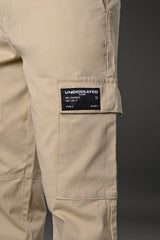Close-up of beige UNDERRATED cargo pants side pocket with 