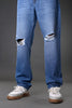 Underrated Club men's blue ripped jeans knee distressed holes closeup white sneakers casual denim fashion product zoom.
