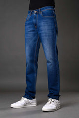 Underrated Club men's slim fit blue jeans front view casual denim pants white sneakers urban fashion product photo.
