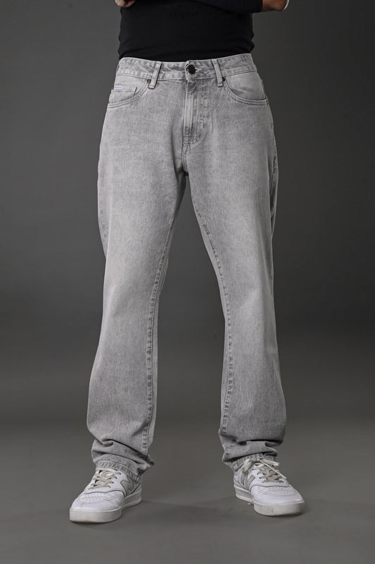 Underrated Club grey wash baggy jeans front full body model black top white sneakers casual fit urban vibe.
