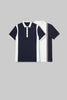 Flat lay of two polo shirts in white and navy blue, showing the reverse colorway of the diagonal panel design.