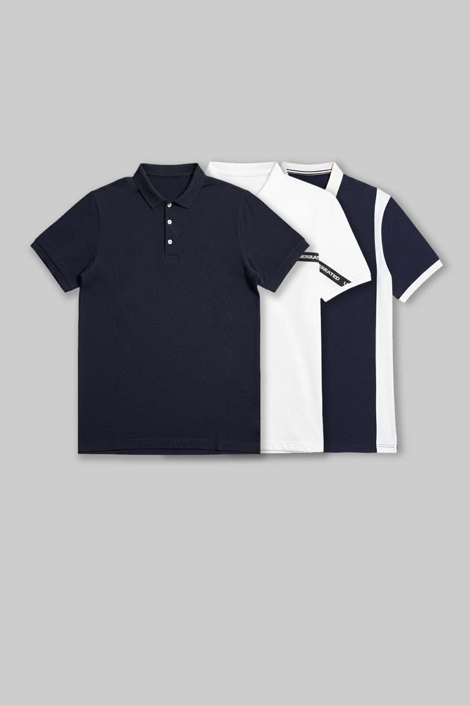 Flat lay of two folded polo shirts in navy blue and white, featuring contrasting side panel designs.
