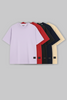 UNDERRATED oversized purple t-shirt with brand tag on grey background - men's streetwear basic.
