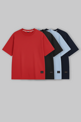 UNDERRATED oversized t-shirts quartet in red, black, light blue, and navy colors with brand tags against grey background - men's streetwear pack.
