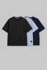 UNDERRATED oversized t-shirts trio in black, light blue, and navy colors with brand tags against grey background - men's streetwear basics.
