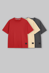 UNDERRATED oversized red t-shirt with brand tag on grey background - men's streetwear essential.
