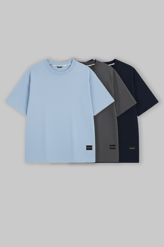 UNDERRATED oversized light blue t-shirt with brand tag on grey background - men's casual oversized tee.
