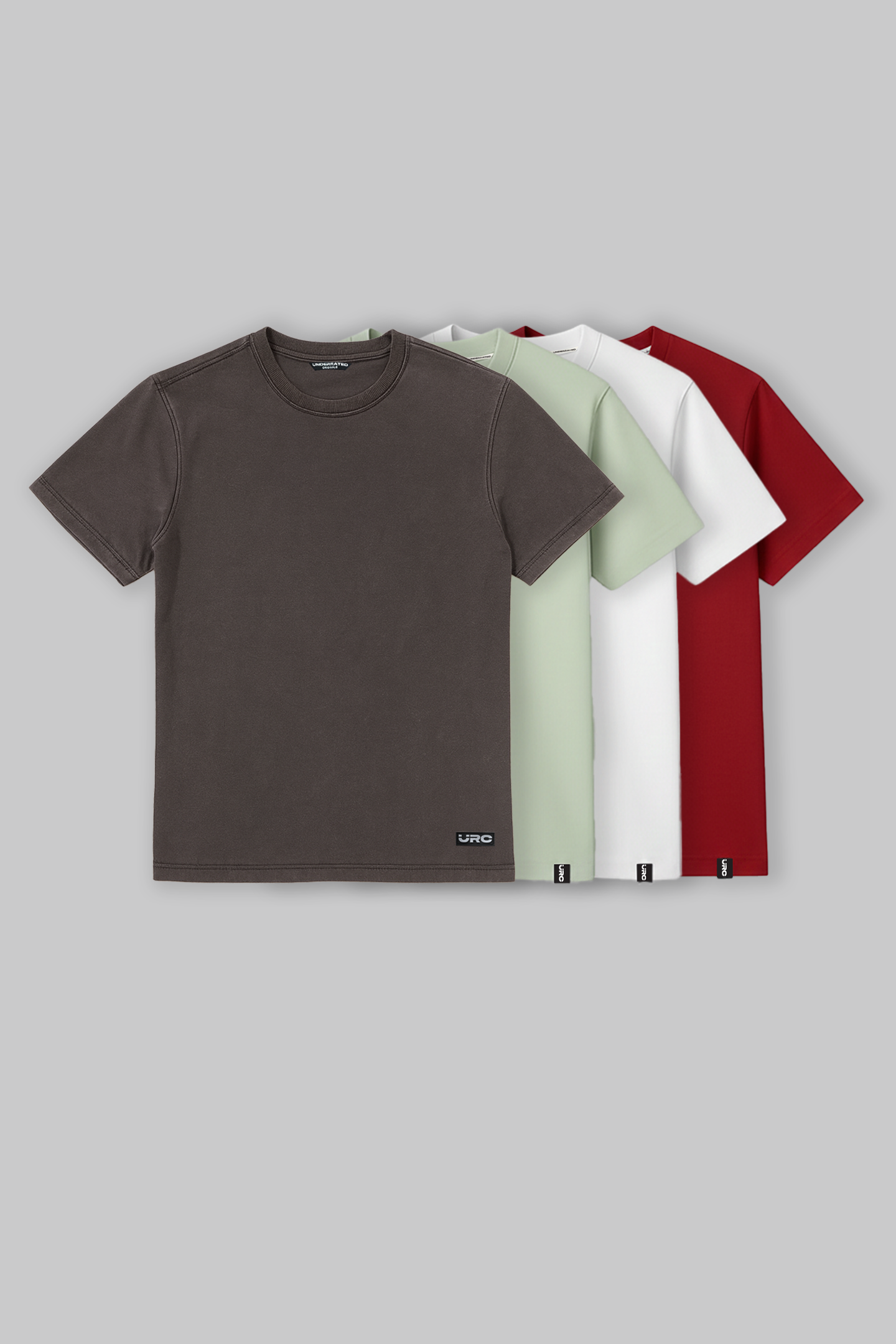 Pack of three men's crew neck t‑shirts in brown, white, and red laid flat on a light background.