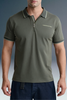 Front view from the chest up of a man standing straight, highlighting the zip-up or open placket design and contrast-striped collar of an olive green polo shirt.