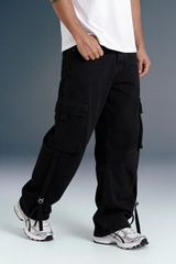 Side Angle of Black Relaxed Fit Cargo Pants with Sneakers