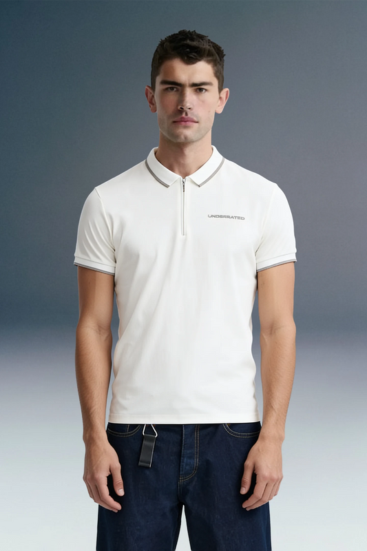 Three-quarter front shot from the waist up of a man facing forward, wearing a white polo shirt featuring a striped collar edge and small left-chest text.