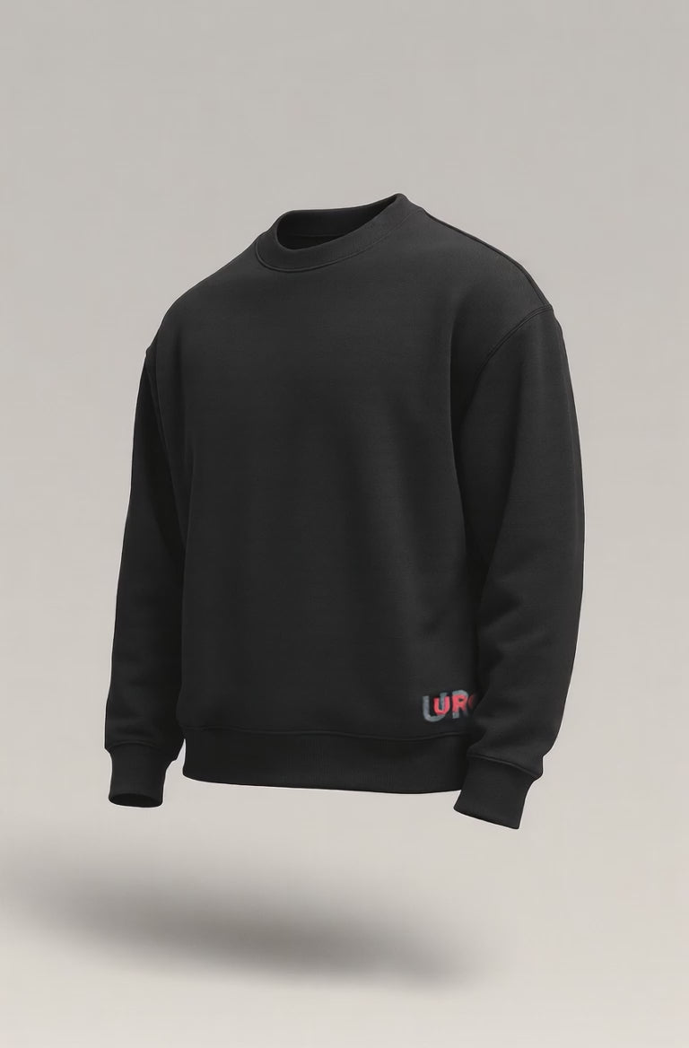 Black oversized crewneck sweatshirt with a small, colorful URC logo print near the left hem.