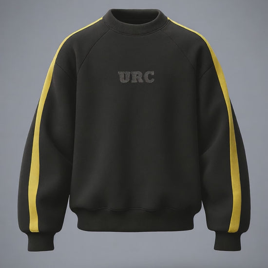 Black raglan crewneck sweatshirt with thick yellow stripes on the sleeves and a tonal URC logo on the chest.