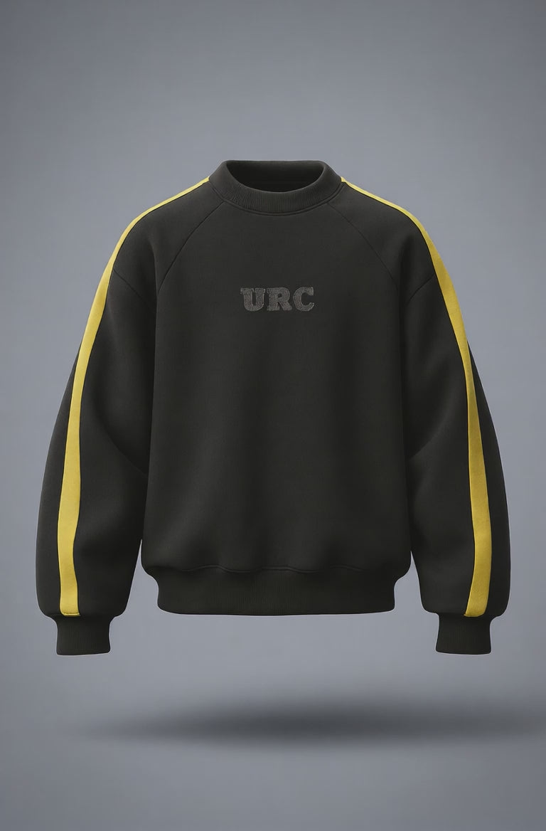 Black raglan crewneck sweatshirt with thick yellow stripes on the sleeves and a tonal URC logo on the chest.