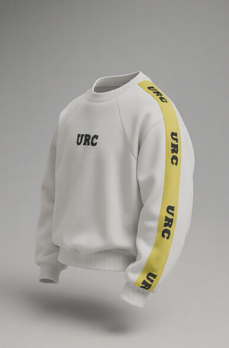 White sweatshirt with a high neck, black URC logo on the chest, and a bold yellow racing stripe on the sleeve with repeated black text.