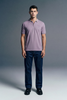 Full-length front view of a man standing still, wearing a light lavender polo shirt paired with dark blue trousers.