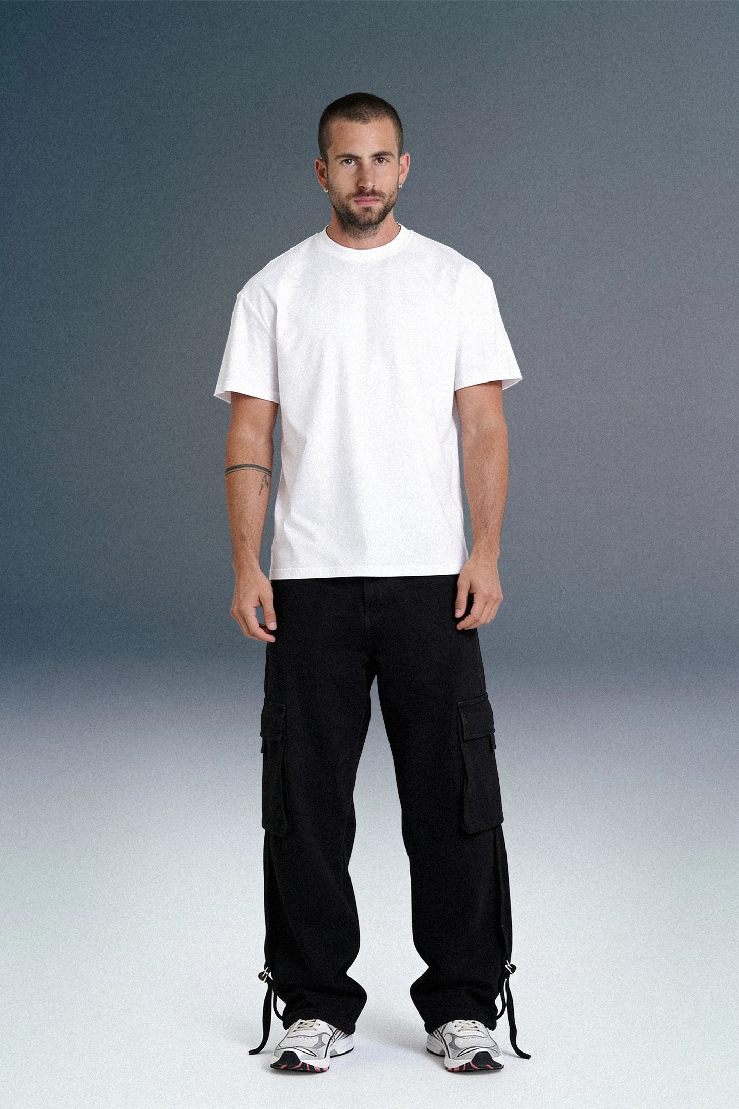 Minimal Men’s Streetwear Outfit with White T-Shirt and Black Cargo Pants