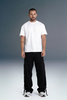 Minimal Men’s Streetwear Outfit with White T-Shirt and Black Cargo Pants